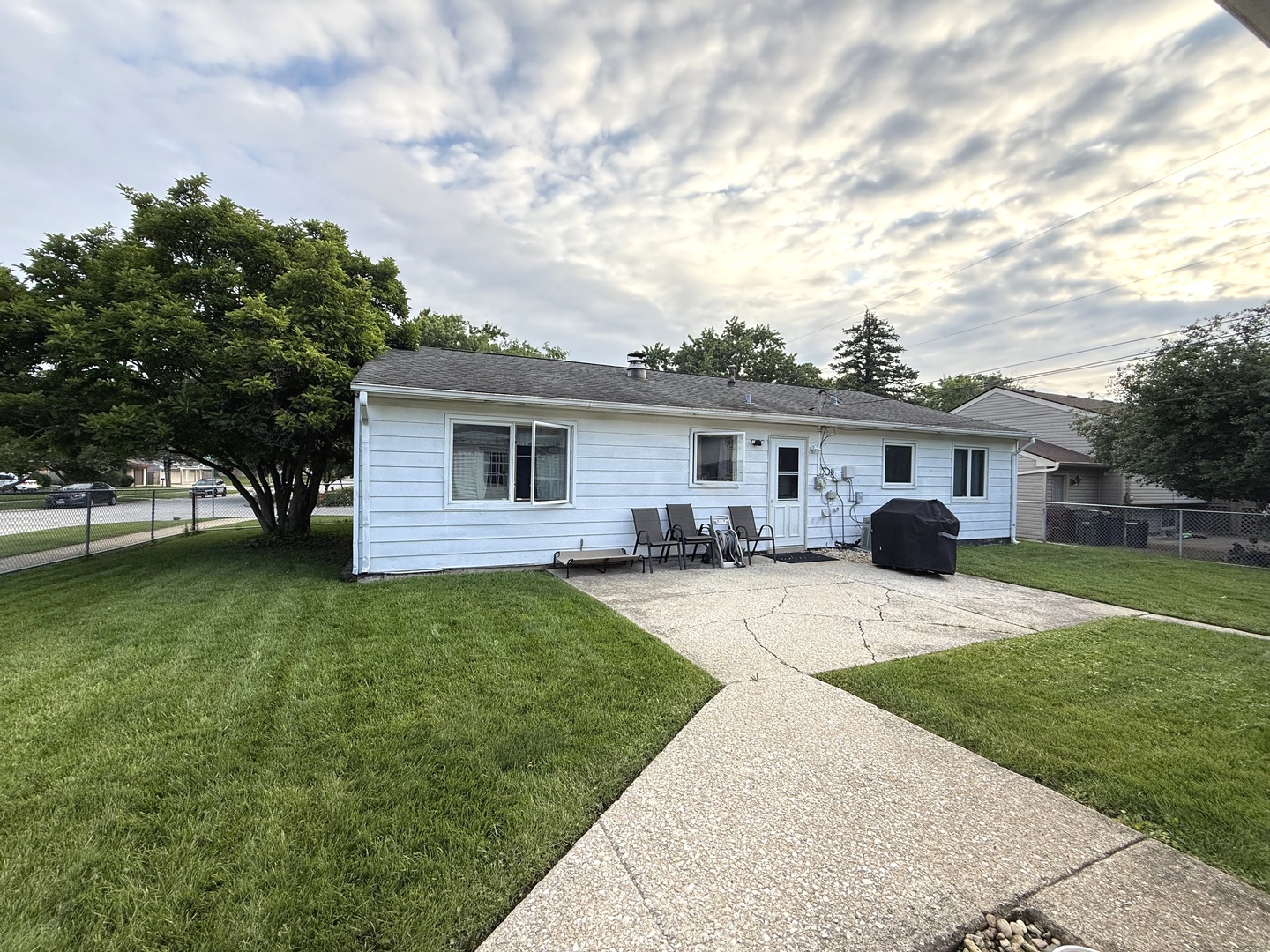 5199 Elmwood Road Oak Forest, IL 60452 - Photo 3 of 30 a front view of house with yard and trees