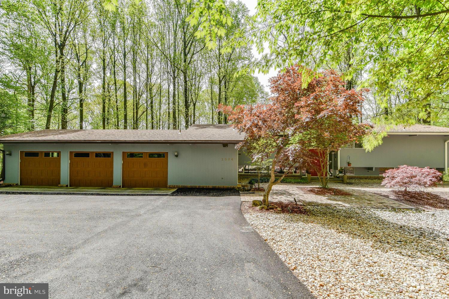 2004 Rebecca Court Silver Spring, MD 20906 - Photo 2 of 30 a front view of a house with a yard and garage