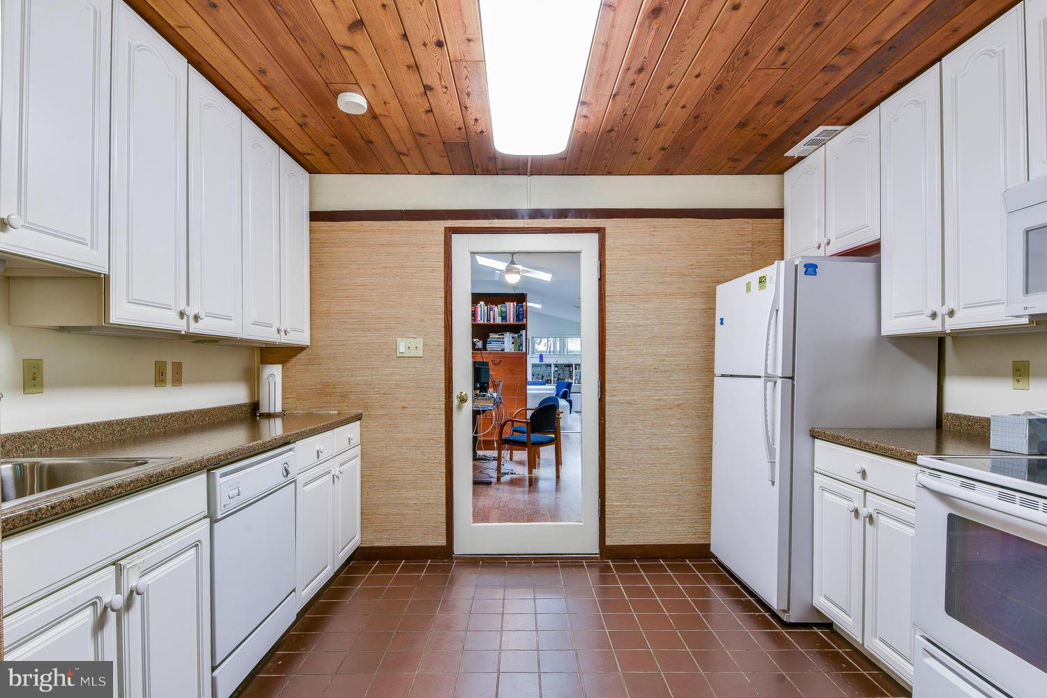 2004 Rebecca Court Silver Spring, MD 20906 - Photo 20 of 30 a kitchen with stainless steel appliances granite countertop a refrigerator and a stove top oven