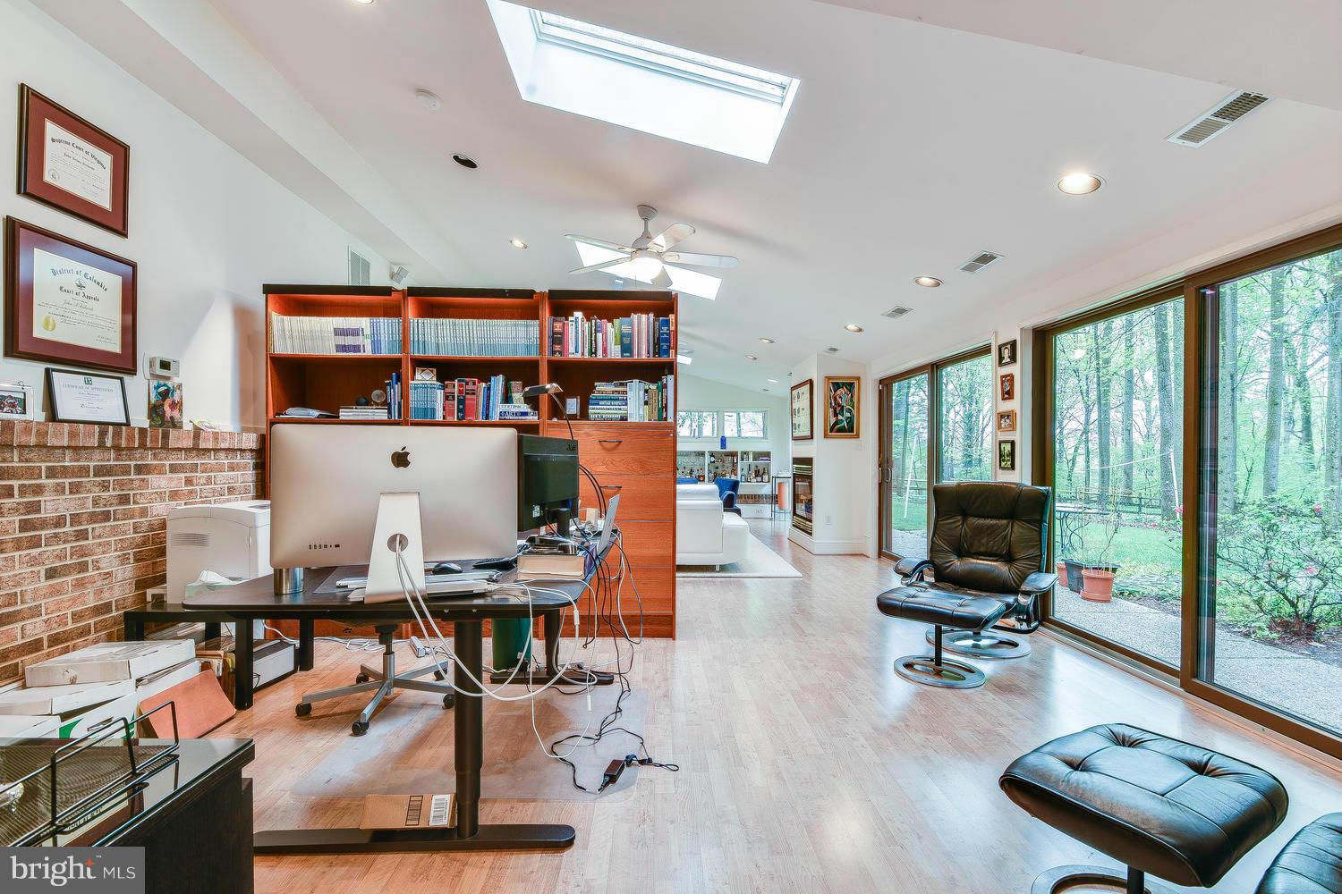 2004 Rebecca Court Silver Spring, MD 20906 - Photo 21 of 30 a room with furniture gym equipment and a floor to ceiling window