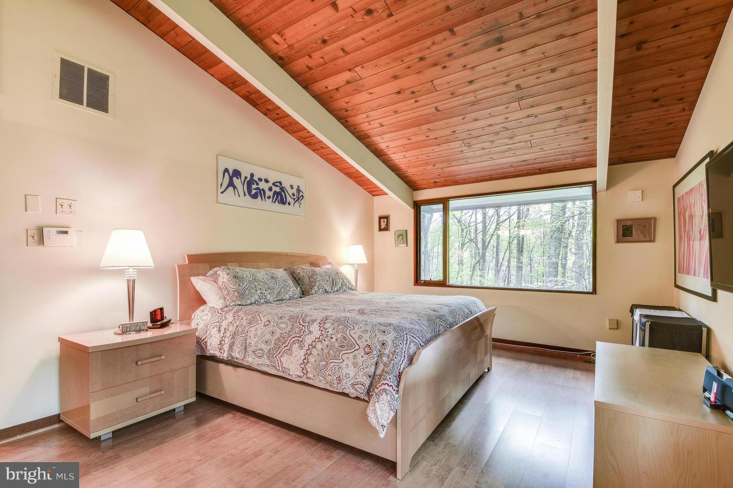 2004 Rebecca Court Silver Spring, MD 20906 - Photo 9 of 30 a bedroom with a bed and a night stand