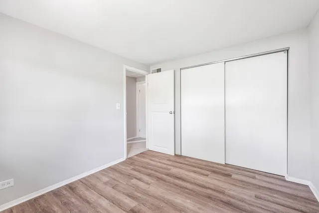 a view of room with wooden floor