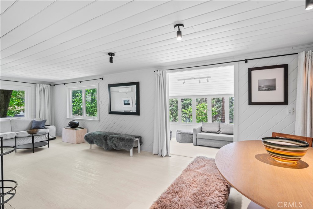 609 Millburn Road Lake Arrowhead, CA 92352 - Photo 21 of 60 a living room with furniture and a large window