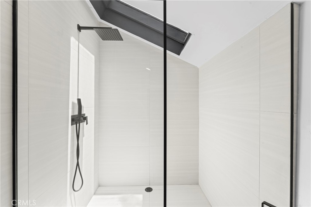 609 Millburn Road Lake Arrowhead, CA 92352 - Photo 45 of 60 a bathroom with a glass shower door