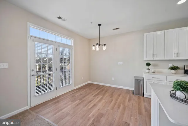 a view of a livingroom with a ceiling fan and window