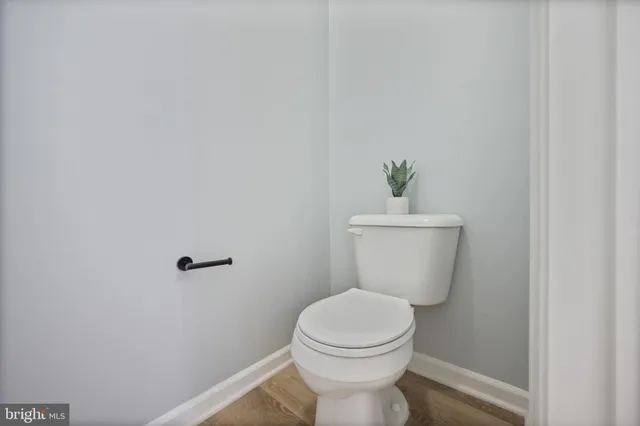 a view of a hallway with closet and door