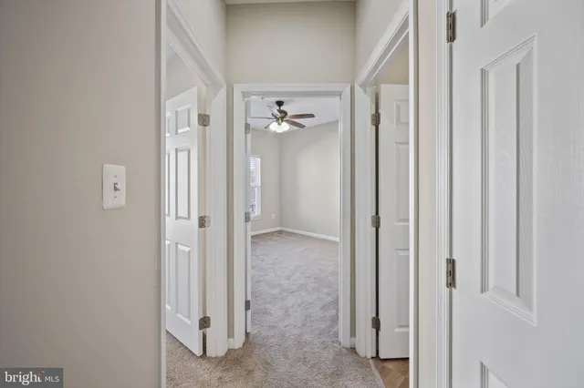 a bedroom with a large bed and a desk
