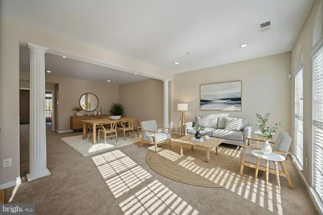 a living room with furniture and a table