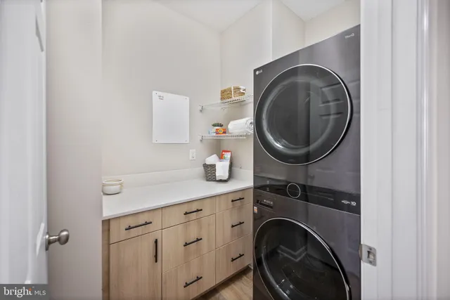 a view of a street that has couple of cars parked on the road