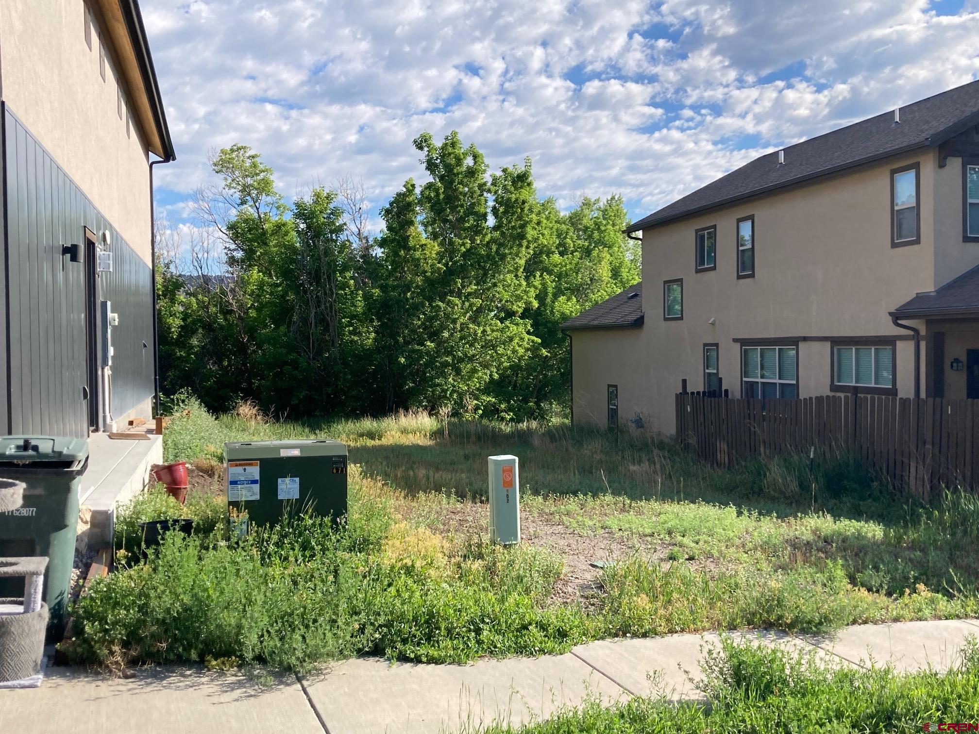 Lot 19-tbd Le Ranch Boulevard Ridgway, CO 81432 - Photo 3 of 11 a backyard of a house with lots of green space