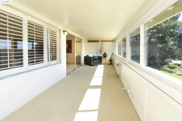 a view of a dining room with furniture and windows