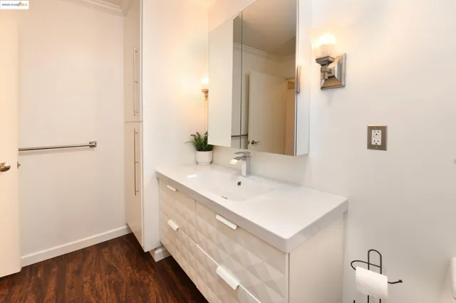 a bedroom with bed and a desk