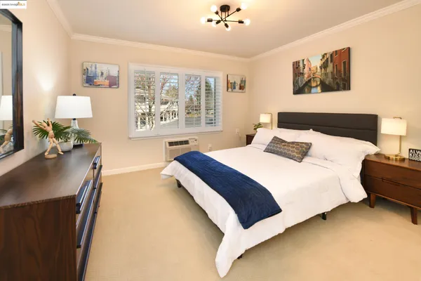 a bedroom with bed and a couch