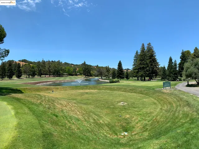 a view of a golf course with a lake