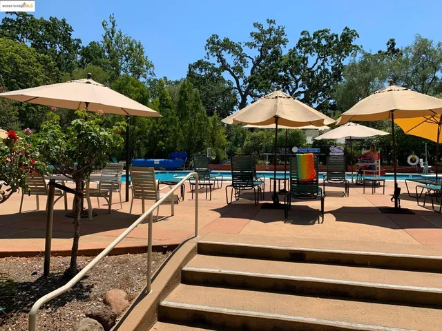 a view of a backyard with sitting area