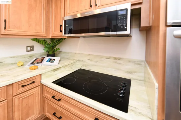 a kitchen with a stove and a microwave