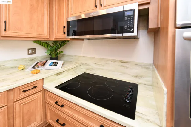 a kitchen with a stove and a microwave