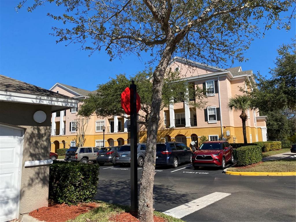 3577 Conroy Road, Unit 321 Orlando, FL 32839 - Photo 1 of 1 a front view of a house with garden