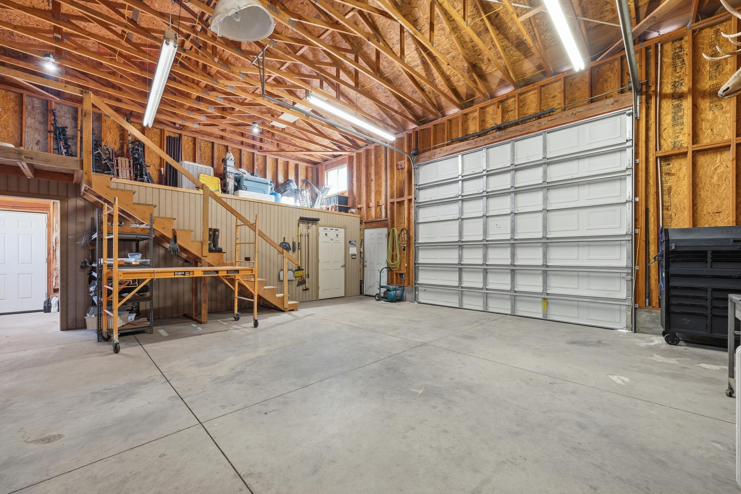 4074 Southwest Reif Road Powell Butte, OR 97753 - Photo 35 of 59 a view of a room with furniture and racks