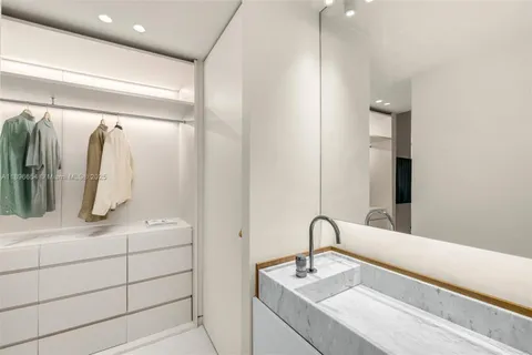 a bathroom with a double vanity sink and mirror