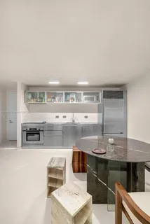 a kitchen with counter top space and appliances