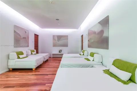 a view of a living room and a floor to ceiling window