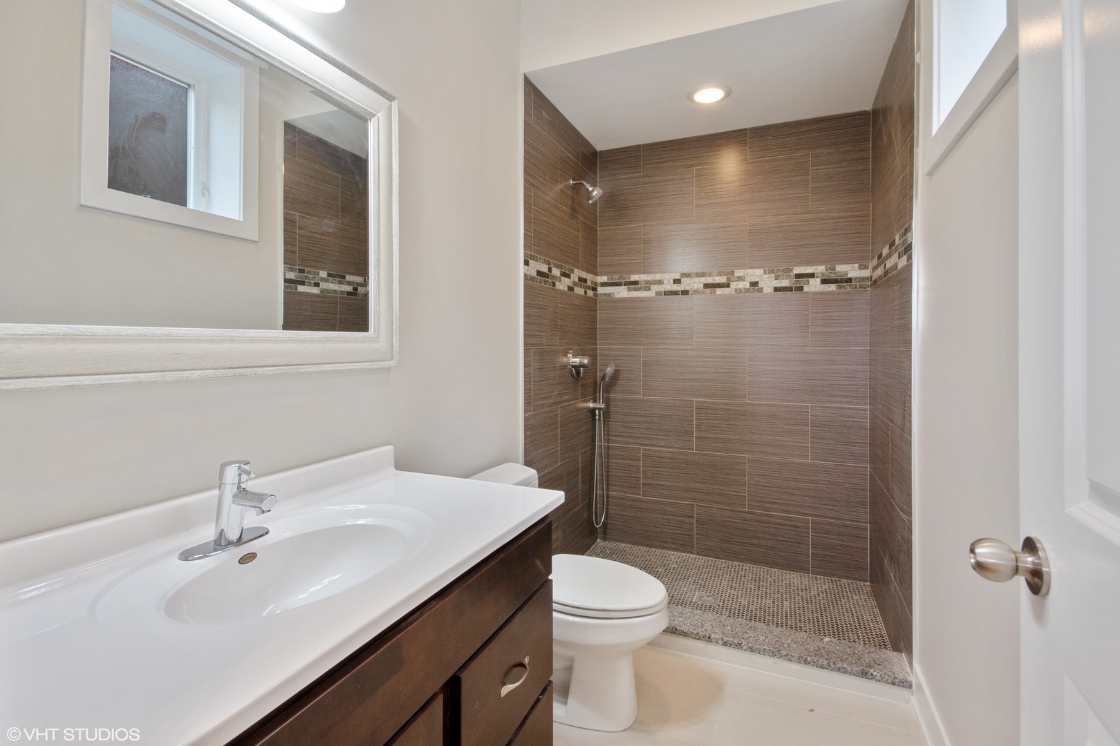 3750 North Racine Avenue, Unit 2 Chicago, IL 60613 - Photo 9 of 10 a bathroom with a sink shower and a toilet