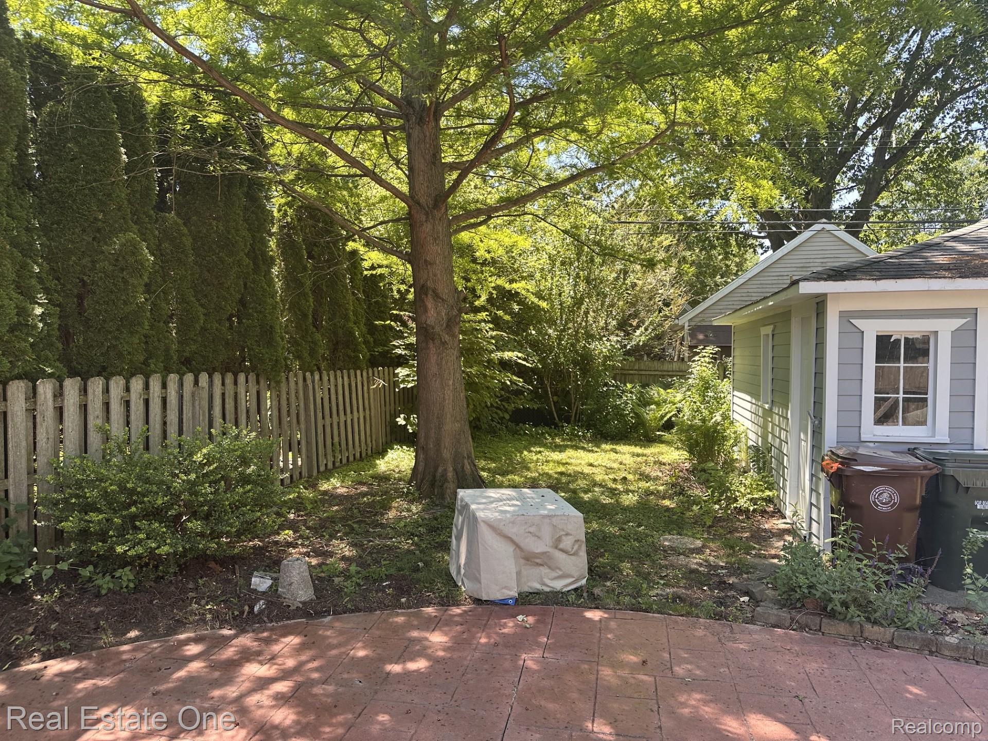 2073 Roslyn Road Grosse Pointe, MI 48236 - Photo 25 of 30 Stamped patio for outside fun, with gated yard, and 1.5 car garage for privacy.