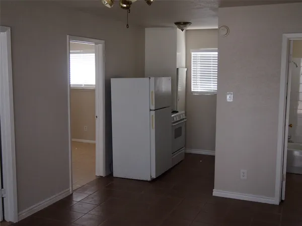 a kitchen with a stove and a window