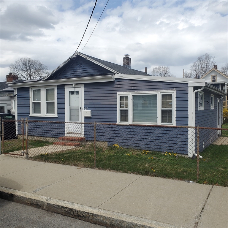 27 Halborn Street Boston, MA 02126 - Photo 1 of 20 a front view of a house with a garden