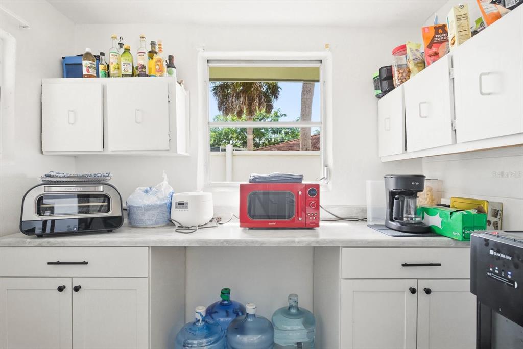 4276 Rudder Way New Port Richey, FL 34652 - Photo 12 of 29 a kitchen with a refrigerator and a stove