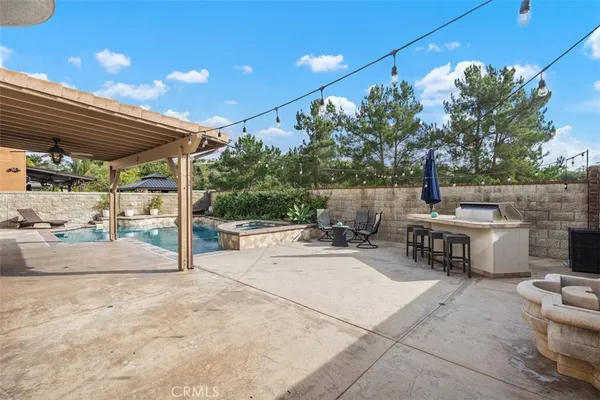 a view of a backyard with sitting area