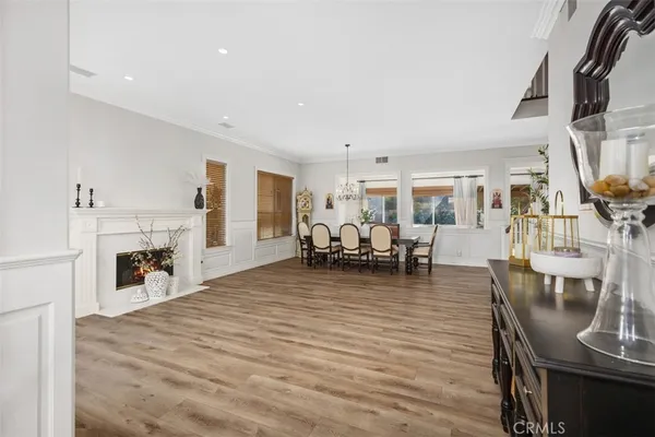 a view of a living room kitchen and a wooden floor