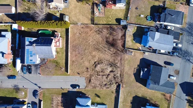 an aerial view of houses and roads