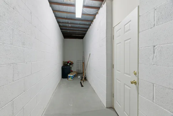 a swimming pool with big trees and a big yard