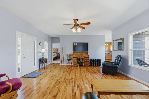 a living room with furniture and a flat screen tv