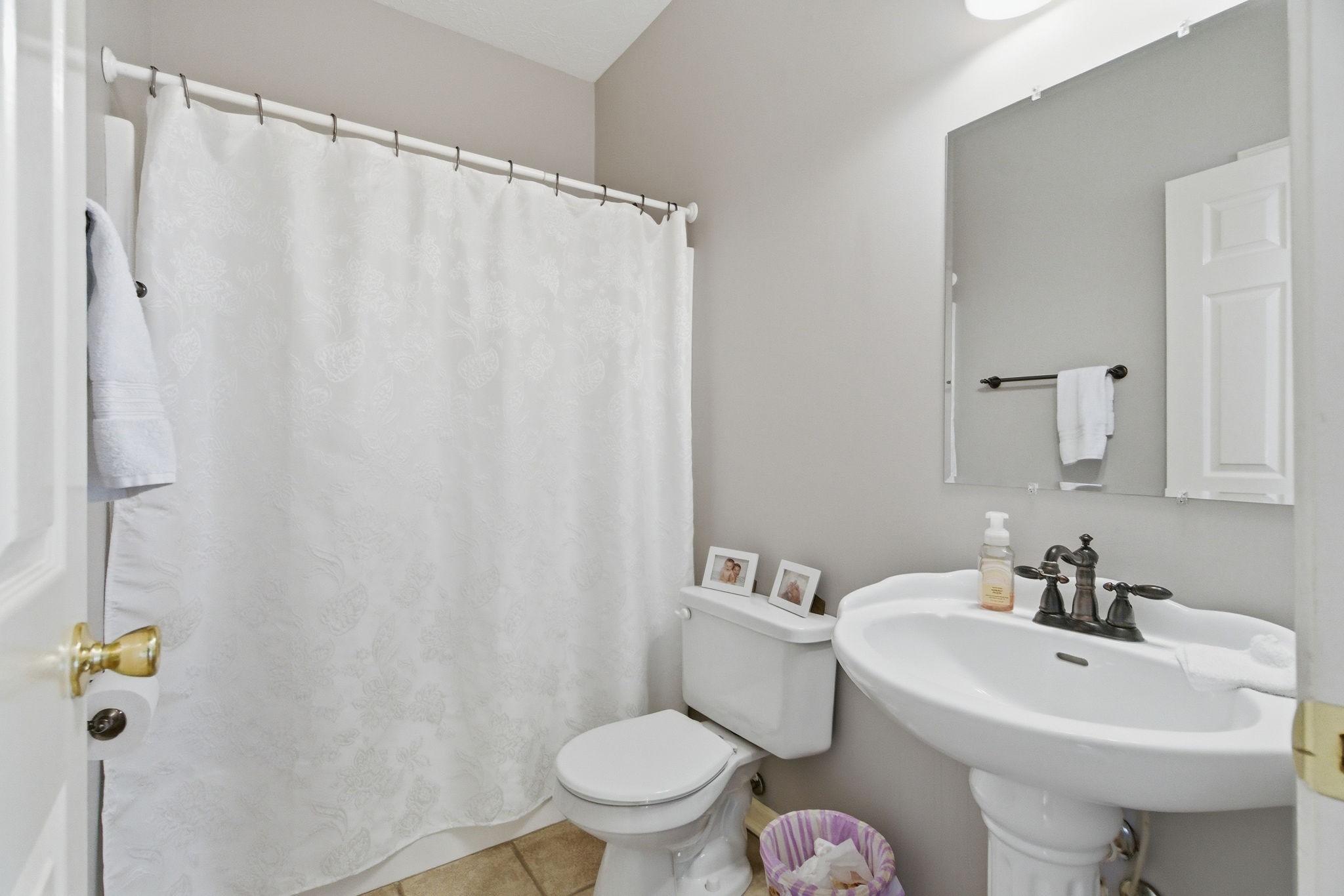 4357 Airport Road Springfield, TN 37172 - Photo 6 of 49 a white toilet sitting next to a bathroom sink