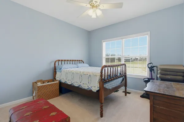 a bedroom with furniture and a window