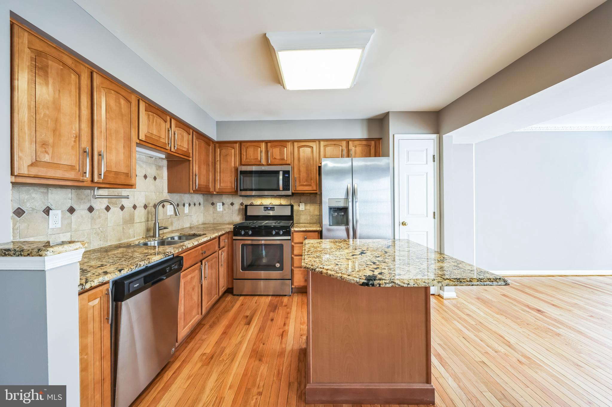 76 Millstream Road Pine Hill, NJ 08021 - Photo 14 of 30 a kitchen with stainless steel appliances granite countertop sink stove refrigerator and cabinets