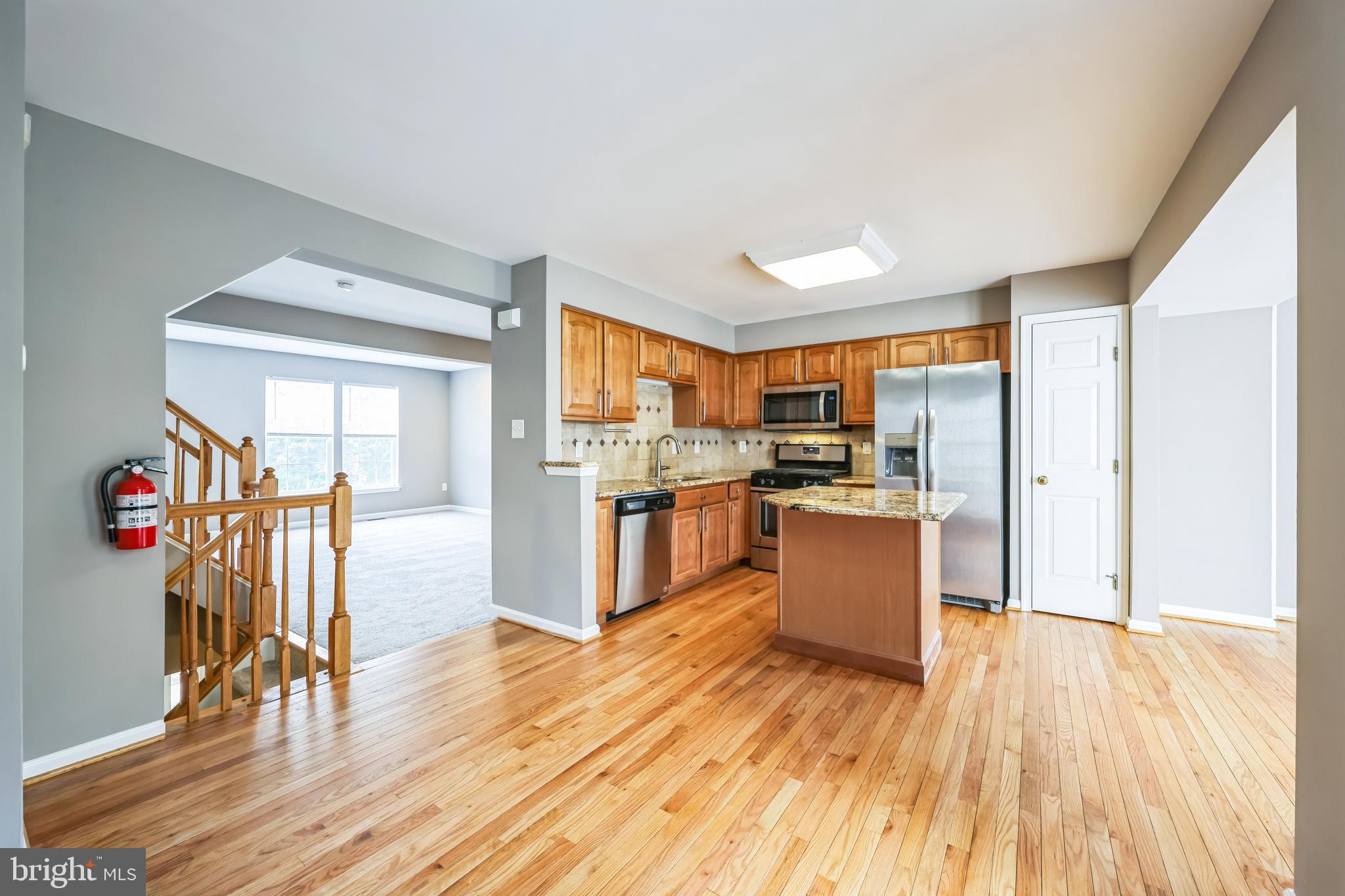 76 Millstream Road Pine Hill, NJ 08021 - Photo 16 of 30 a kitchen with a wooden floor and a view of living room