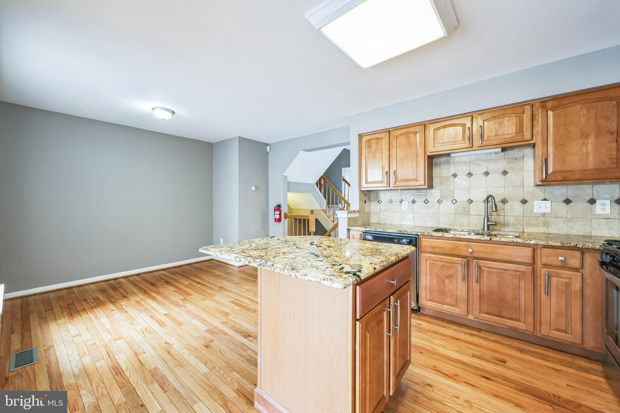 76 Millstream Road Pine Hill, NJ 08021 - Photo 17 of 30 a kitchen with stainless steel appliances granite countertop a sink stove and cabinets