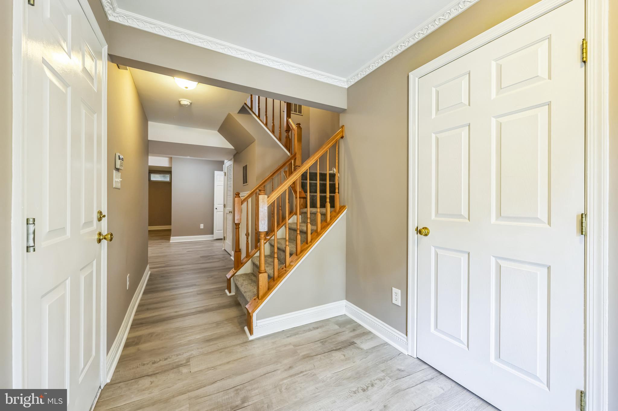 76 Millstream Road Pine Hill, NJ 08021 - Photo 2 of 30 a view of a hallway with wooden floor and entryway