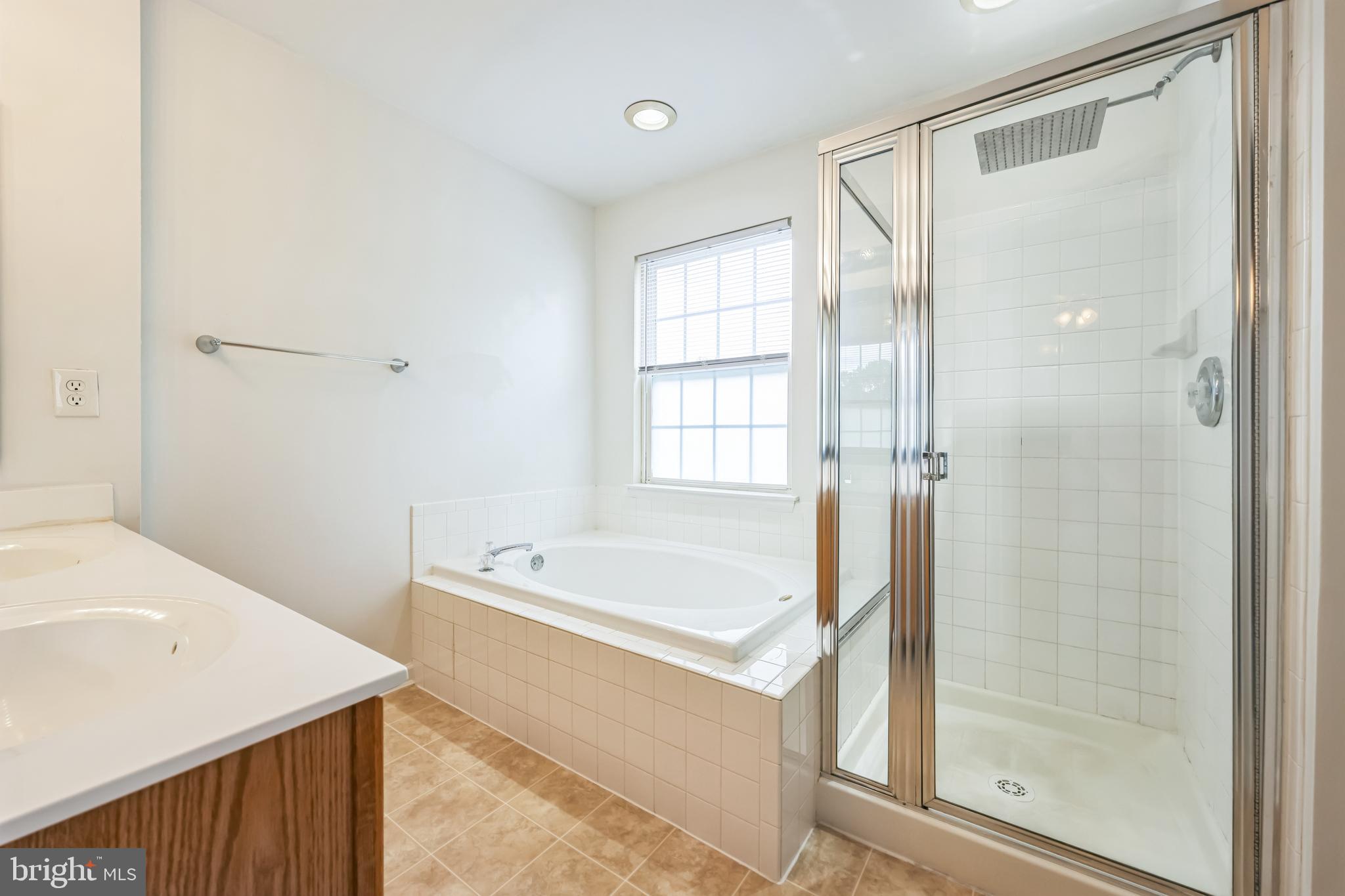 76 Millstream Road Pine Hill, NJ 08021 - Photo 26 of 30 a bathroom with a tub shower and sink