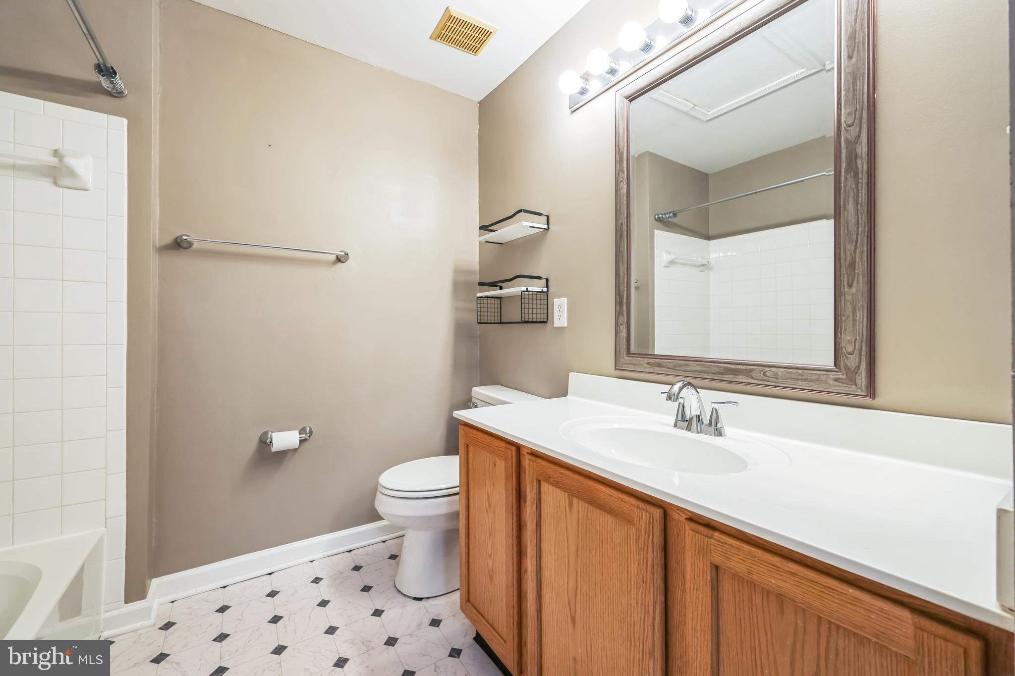 76 Millstream Road Pine Hill, NJ 08021 - Photo 29 of 30 a bathroom with a sink a toilet and shower