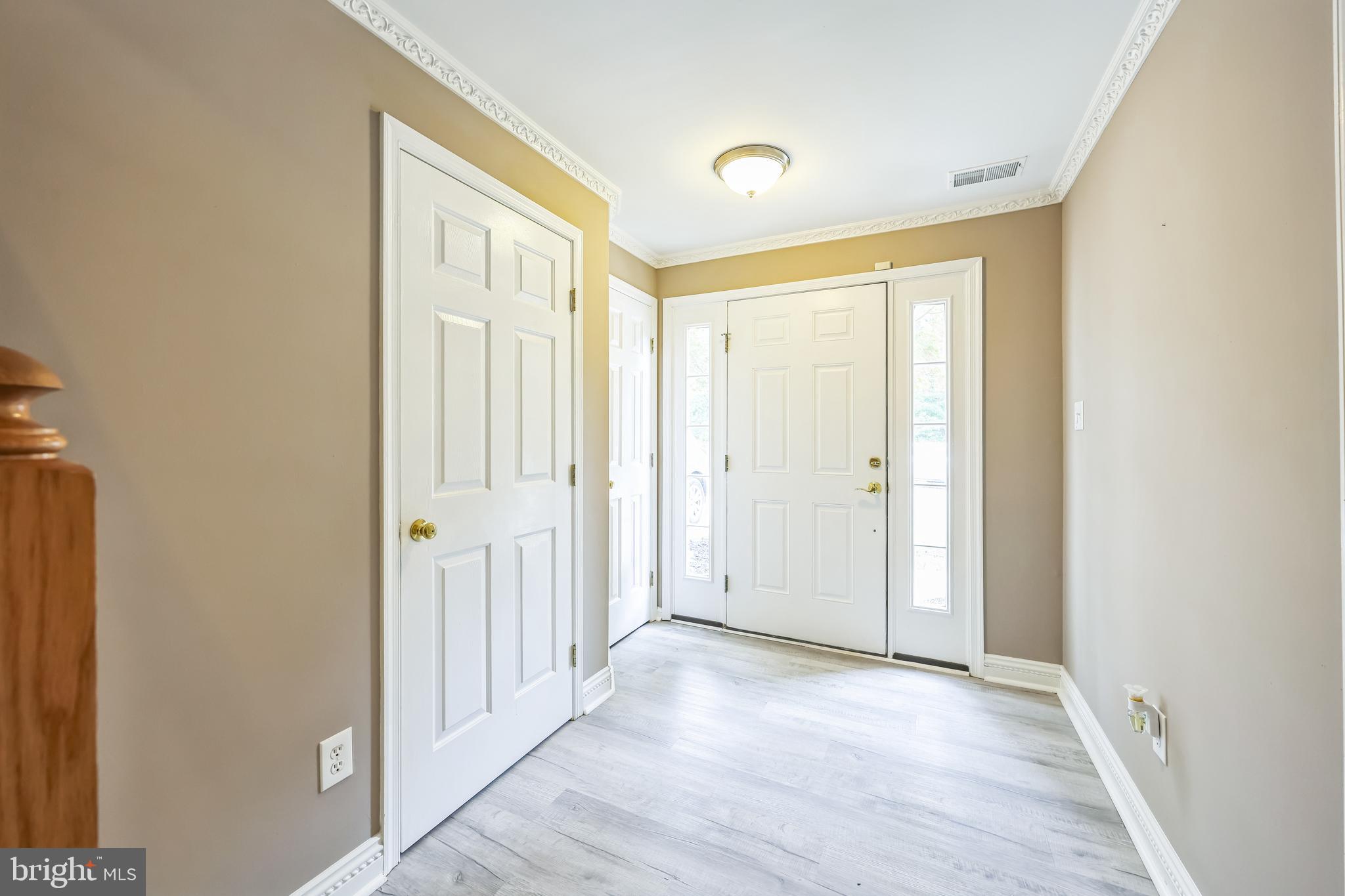 76 Millstream Road Pine Hill, NJ 08021 - Photo 3 of 30 a view of a hallway with wooden floor