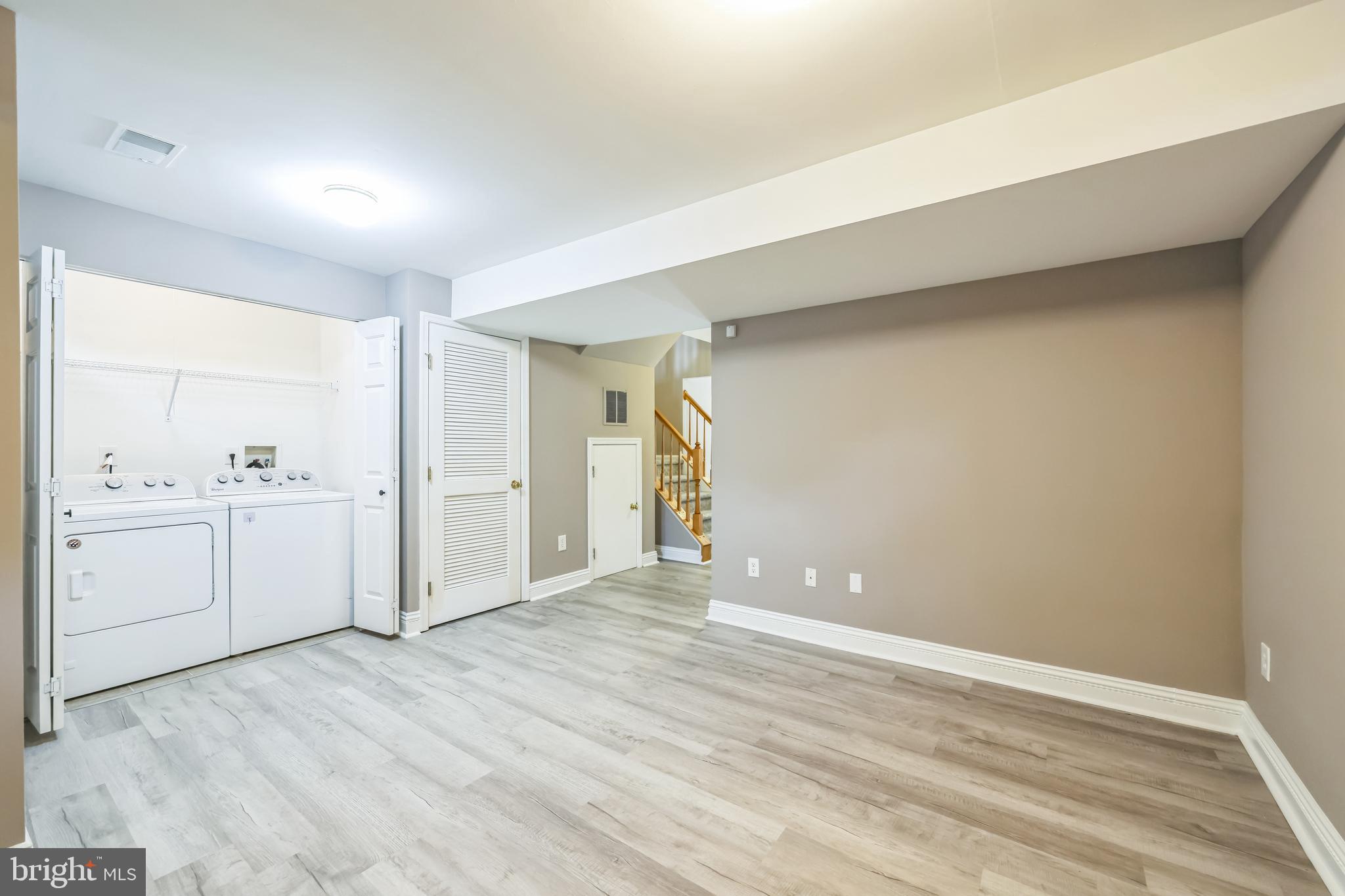 76 Millstream Road Pine Hill, NJ 08021 - Photo 5 of 30 a view of a room with white cabinets and wooden floor