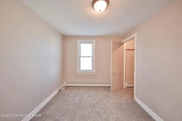 an empty room with windows