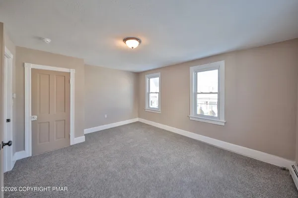 an empty room with windows