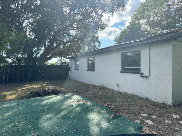 a backyard of a house with lots of green space
