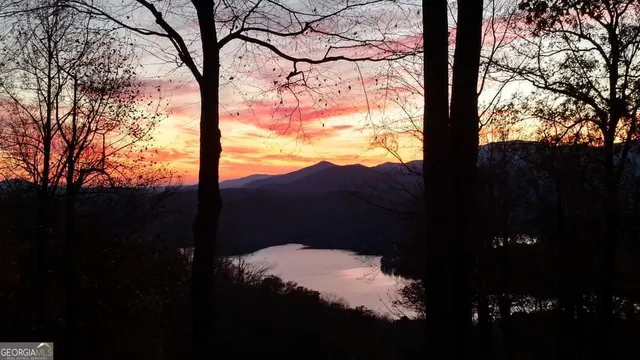 a very nice looking kitchen with granite countertop a large window and a sink